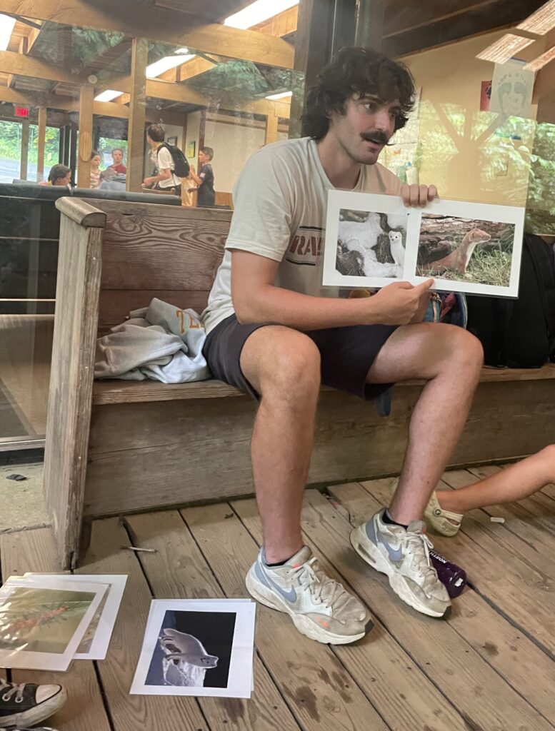 Mason reading a book to a group of children