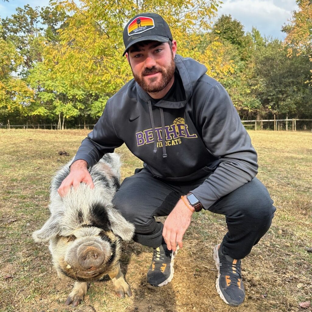 Conner Boley with a pig