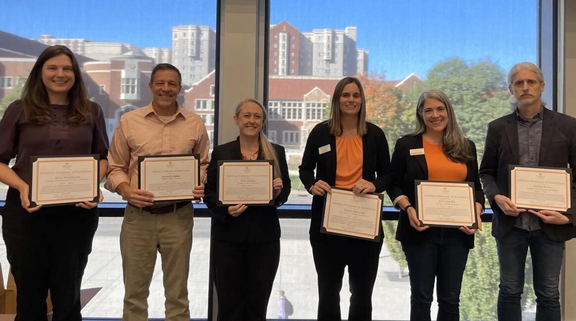 Karen DeLong accepting the Athletics Professor of Excellence award from the UT Knoxville Faculty Senate