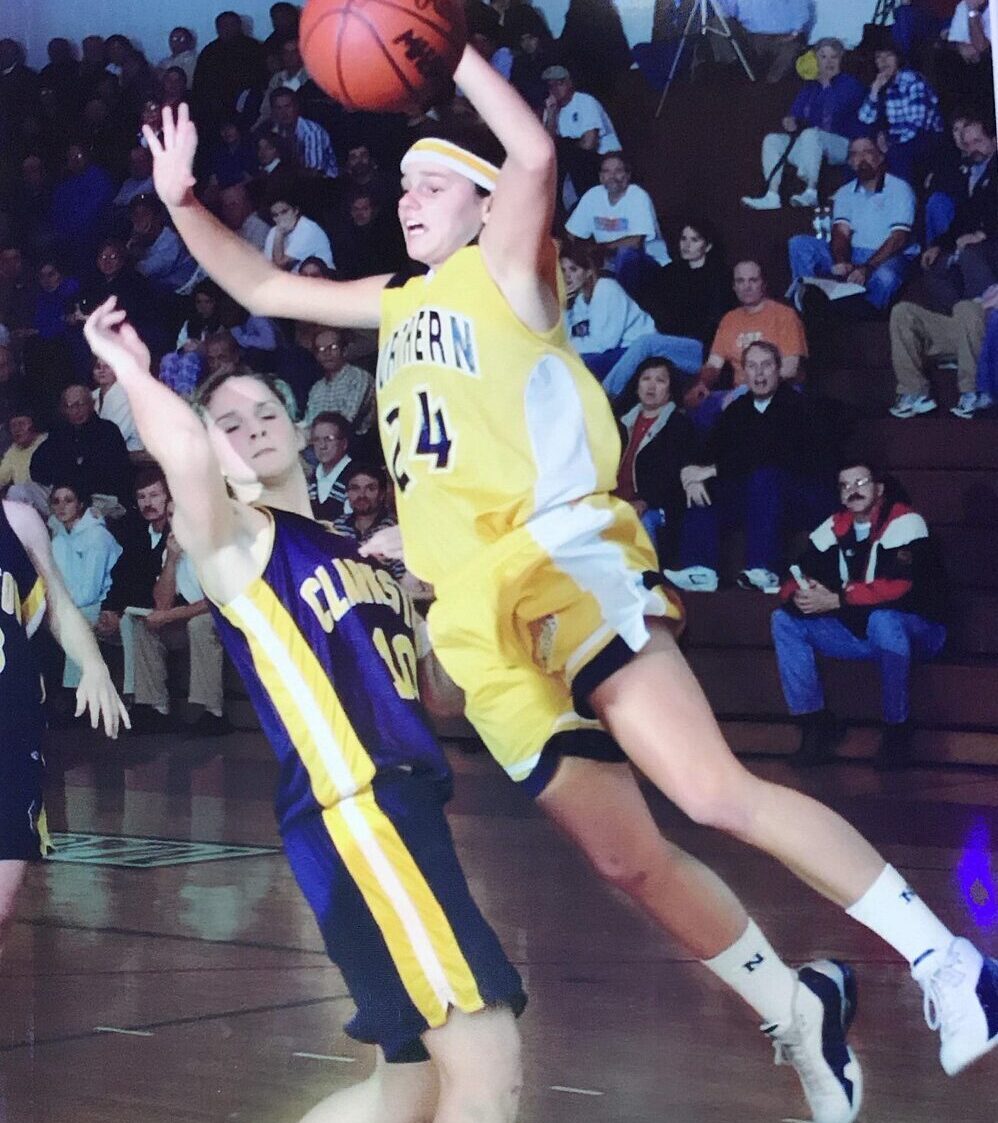 Karen DeLong playing high school varsity basketball for Port Huron Northern High School, Michigan