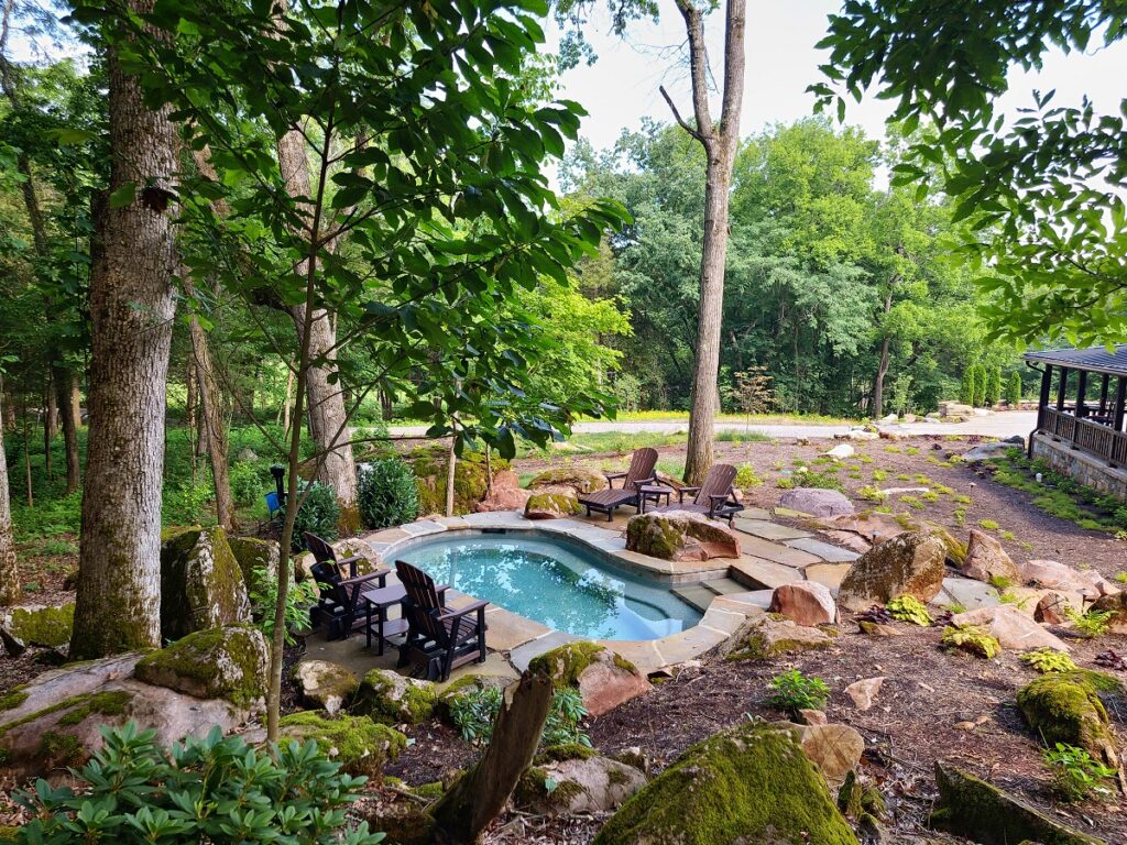 A lush backyard with both landscape and hardscape design