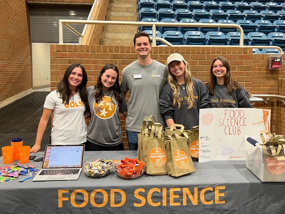 Bryce Mckenzie and other students at a food science club booth