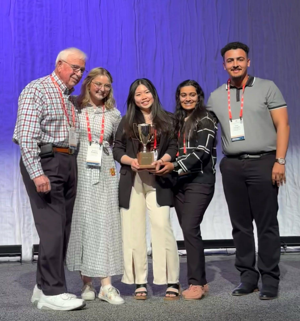 Ploy Wong with Dr. Charles White and the Collegiate Dairy Products Evaluation Team