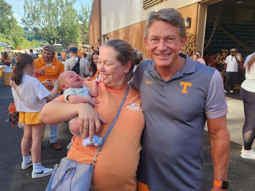 Randy Boyd and Liz Eckelkamp holding her newborn baby at Ag Day 2024