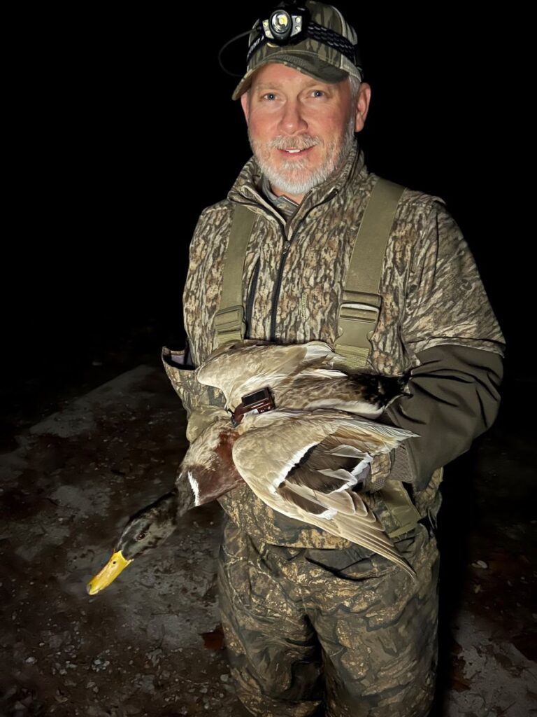 Jason Maxedon holding a hunted mallard