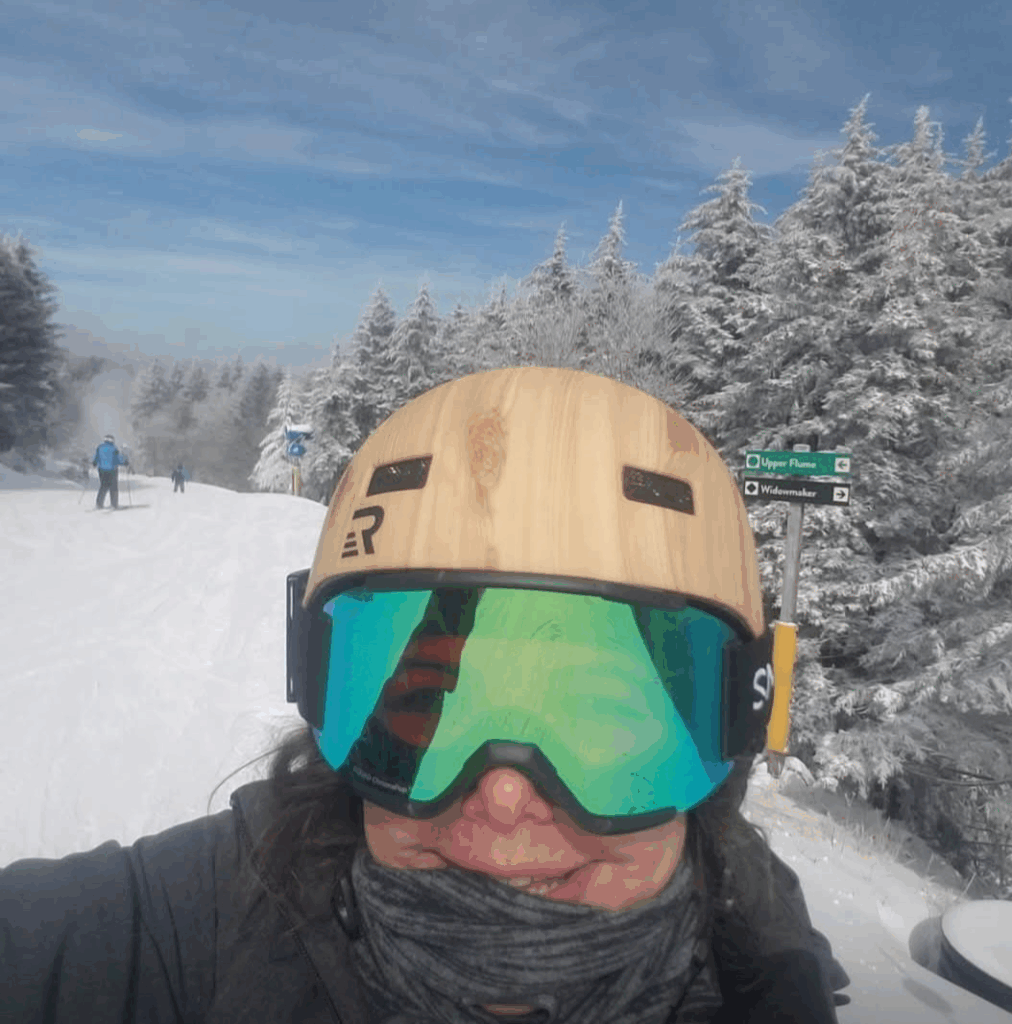 Shalena Durkot wearing a helmet and goggles on a ski slope.