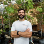Aaron Onufrak in a greenhouse