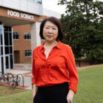 Toni Wang standing in front of the food science building