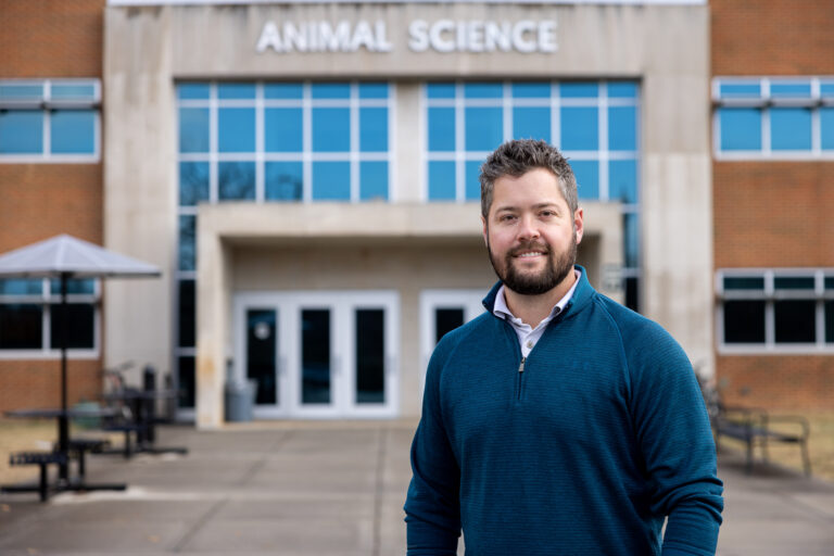 Phil Myer standing in front of the Animal Science building