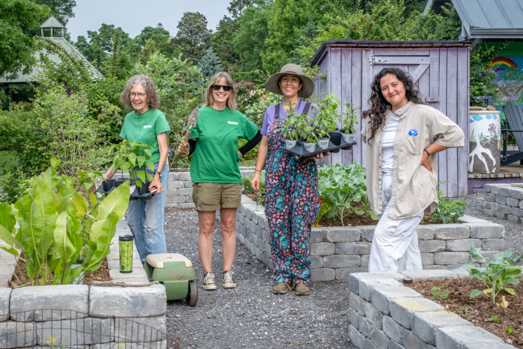 Holly working with volunteers in the garden