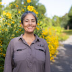 Holly Jones with yellow flowers