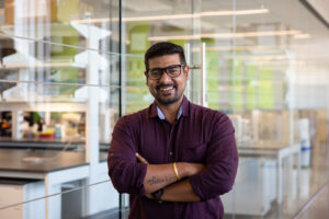 Deb Saha standing in front of a lab