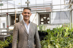 Headshot of Juan Luis Jurat-Fuentes in a greenhouse