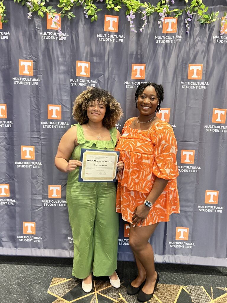 Genesis Nolan with an award for Mentor of the Year