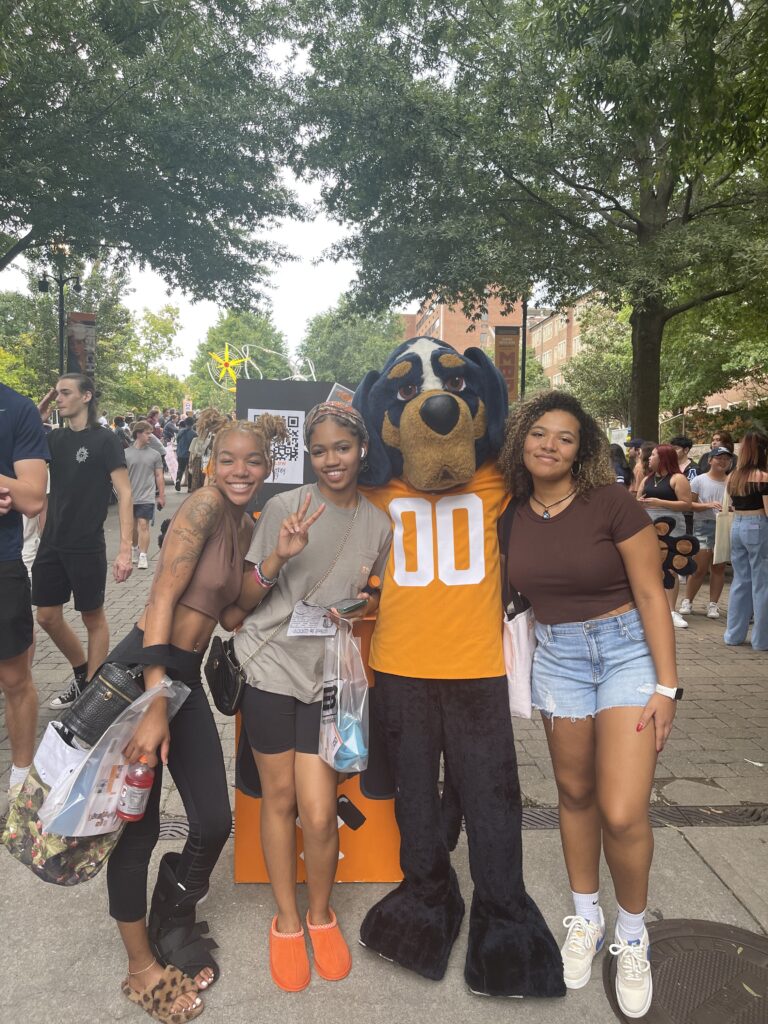 Genesis Nolan and friends with the costume Smokey Mascot