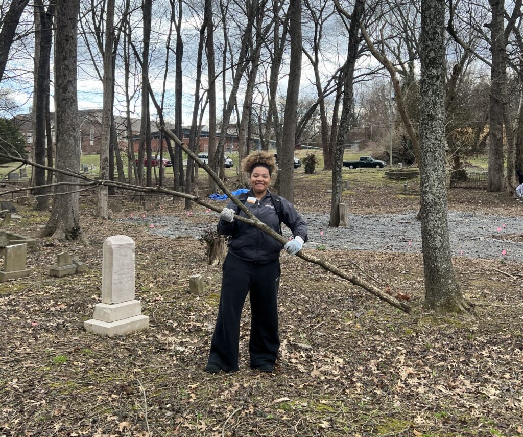 Genesis Nolan at a clean up event for a local cemetery
