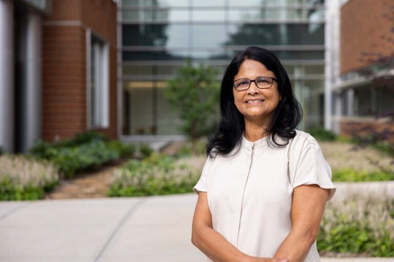 Sindhu Jagadamma in front of the Agriculture and Natural Resources Building