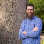 Lee Rumble in front of a tree
