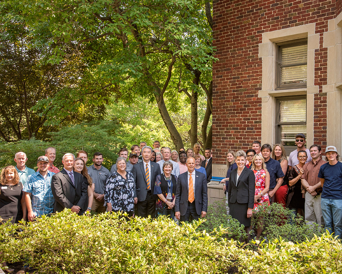 UTIA faculty, staff, and friends gather around the Morgan Hall cornerstone after the installation of the 2021 time capsule
