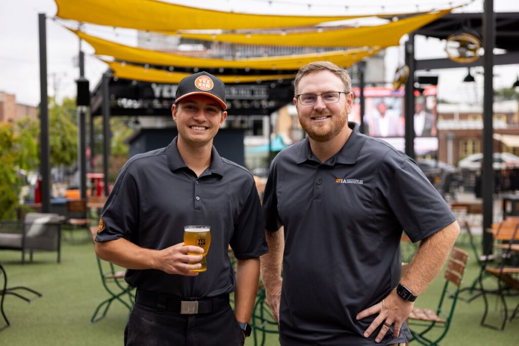 Head brewer at Yee-Haw Knoxville Trevor Daniels and lead researcher of the UT Hopyard project Mitchell Richmond present the new collaborative beer Hopyard Pilsner, made with fresh hops grown at the East Tennessee AgResearch and Education Center, now available on draft at Yee-Haw Knoxville.