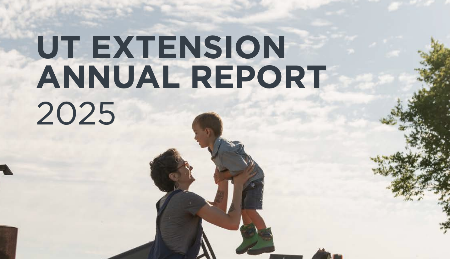 Cover of UT Extension annual report with an image of a parent holding a child near an old tractor