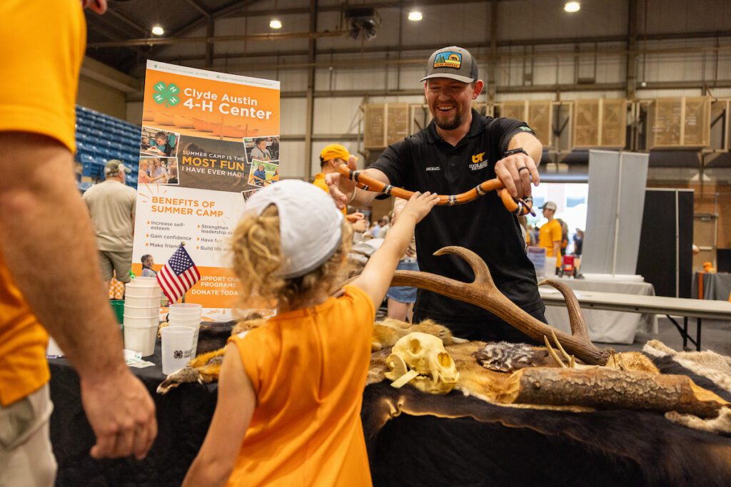 Clyde Austin 4-H Center staff member Michael Stapleton interacts with attendees at Ag Day 2025 in Knoxville, Tennessee, on September 19, 2025. Photo by Haley Harbin/University of Tennessee.