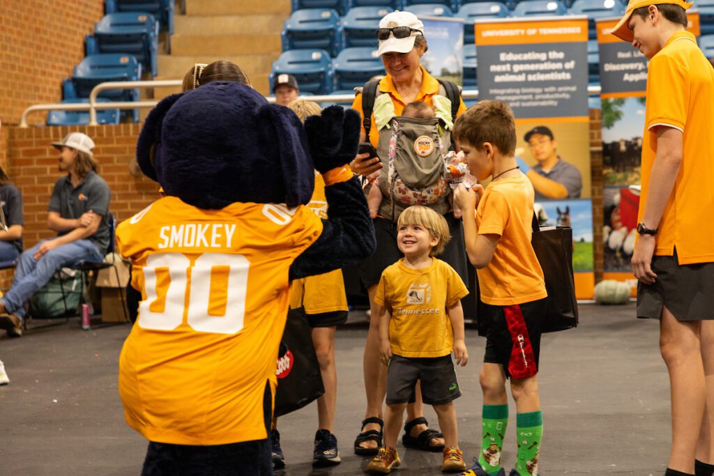 Attendees interact with UT Knoxville Mascot Smokey at Ag Day 2025 in Knoxville, Tennessee, on September 19, 2025. Photo by Haley Harbin/University of Tennessee.